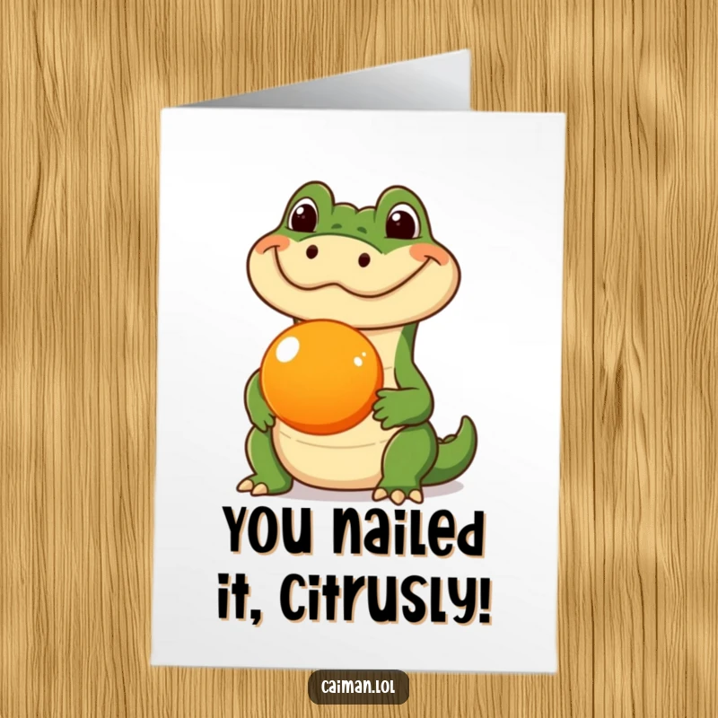 Funny Free Printable Congratulations Card: A caiman with a silly expression balancing a round orange fruit on its snout.
