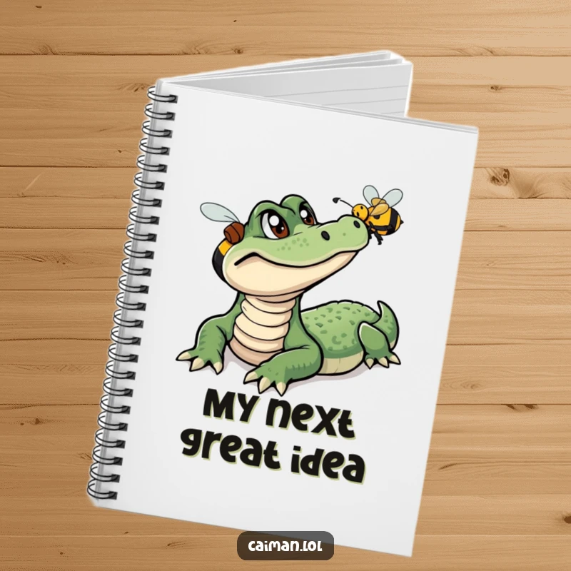 Funny Caiman Notebook, a journal with a humorous cover art of a curious caiman watching a colorful, buzzing bee, great for note-taking.